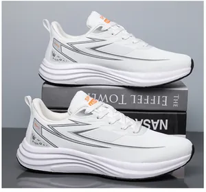 Detailed view of white fashion sports shoes with mesh panels and gray lightning design accent