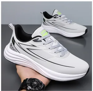 Detail of light gray mesh upper with thick white cushioning midsole and black rubber outsole