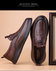 Close-up of brown textured leather business loafers with slip-on design and thick rubber sole