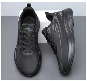Close-up of black sneakers featuring breathable mesh, secure laces, and anti-slip rubber soles