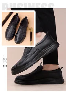 Close-up of black leather loafers with lychee grain texture and thick rubber sole
