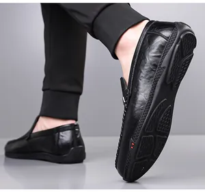 Detail of men's black pebbled leather loafers with slip-on design and rubber driving sole