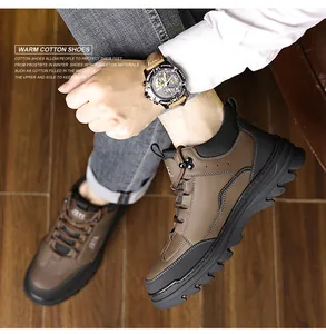 Close-up of men's winter leather boots with non-slip rubber sole and warm wool lining