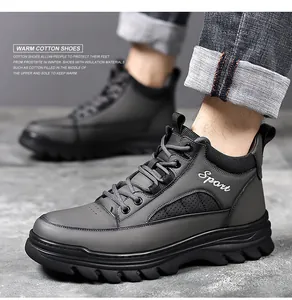 Detail of gray winter boots showing anti-slip rubber sole and sport style stitching