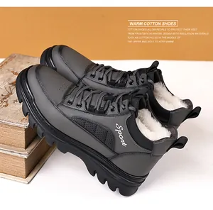 Close-up of men's winter leather boot with thick white plush lining and sport detail