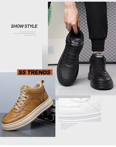 Dettaglio di sneaker alte in pelle nera, marrone e bianca con chiusura stringata