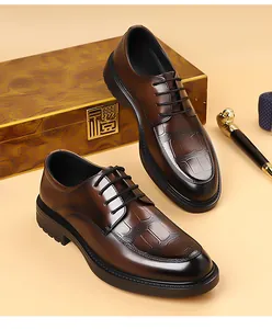 Detail of dark brown leather derby shoes with crocodile texture and gradient finish