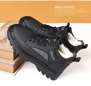 Detail of warm black winter boots with thick white faux fur lining and non-slip sole