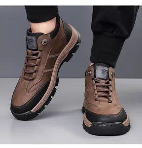 Detailed close-up of brown suede high-top snow boot with durable rubber sole and white stitching