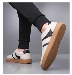 Detail of premium leather men sneakers showing the side profile and brown rubber sole