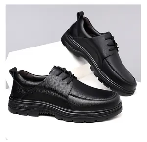 Detail of men's black lychee leather lace-up shoes with sport logo on the thick rubber sole