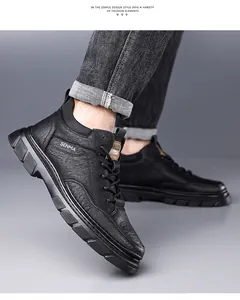 Close-up of black leather men's shoe featuring detailed litchi grain and anti-slip sole