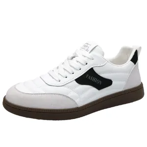 Retro fashion white leather sneakers with gray suede toe and durable brown rubber sole