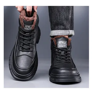 Detail of men's black high-top winter boots with warm brown faux fur lining inside