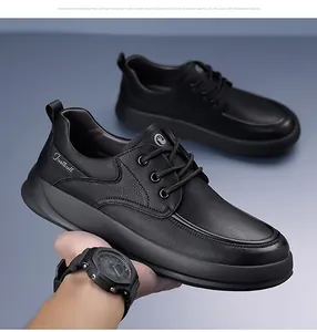 Detail of men's black leather casual shoes featuring textured surface and anti-slip sole