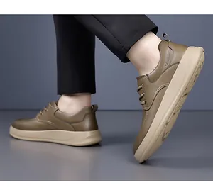 Side view of men's brown leather casual sneakers with thick soles and lace-up design