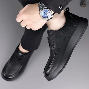 Men's black matte leather casual shoes with non-slip thick rubber soles in a lifestyle view