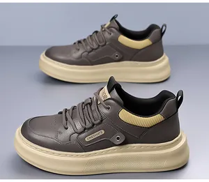 Detail of men's leather casual sneakers featuring grey texture and yellow accents