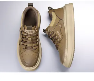 Macro detail of men's brown retro sneaker showing leather texture and non-slip thick sole