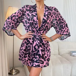 Pink leopard print chiffon kimono robe with waist tie shown in a cozy indoor setting