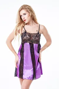 Detail of purple satin sleepwear with black floral lace and ribbon bow accents