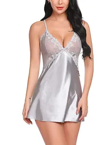 Close-up of elegant lace V-neckline and smooth satin fabric on a silver-gray nightgown