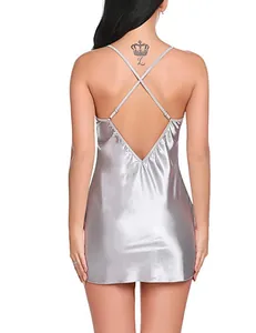 Detailed back view of silver metallic dress with cross straps and backless design