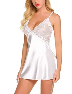 Macro detail of the delicate floral lace and satin texture on the white nightgown