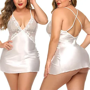 Close-up of white satin nightgown with floral lace stitching and deep V-neckline