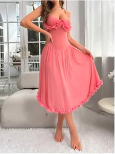 Detailed close-up of pink camisole dress with 3D floral petals and velvet texture