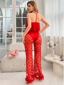 Detail of red mesh lingerie set with heart pattern lace and ruffled wide-leg trousers