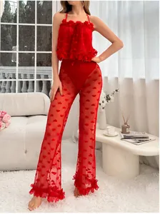 Detailed view of red lace lingerie set with heart pattern mesh and ruffled floral trim