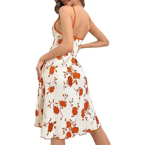 Women's summer floral slip dress in white and orange with an open back and lacing