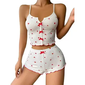 White ribbed pajama set with red heart prints, bow accents and lettuce edge trim