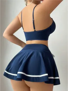 Rear view of sexy navy blue two-piece lingerie set with pleated skirt and white stripes