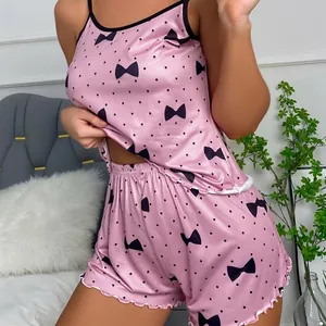 Pink satin two-piece lingerie set with black polka dots and ruffles for women