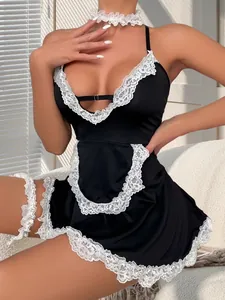 Detail view of lace trim and satin fabric on sexy black and white maid costume set