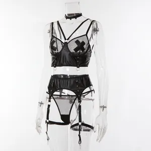Macro detail of sexy black faux leather lingerie with mesh panels and metal rings