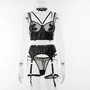 Detail of black faux leather lingerie set with mesh bra and studded garter belt straps