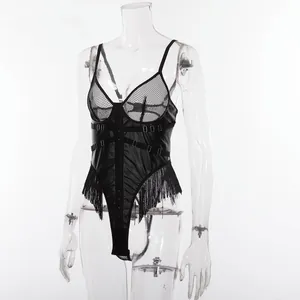Detail of black faux leather bodysuit with mesh inserts and decorative metal rings