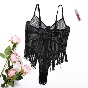 Flat lay of black faux leather bodysuit with fringe hem and mesh detailing