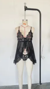 Detail of sheer black lace embroidery on two-piece sexy lingerie set with mesh details