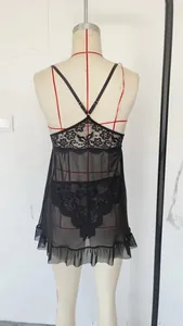 Detailed back view of black lace lingerie set featuring cross straps and ruffled hem