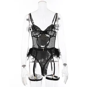 Detailed close-up of black mesh bodysuit with soft feather trim and suspender straps