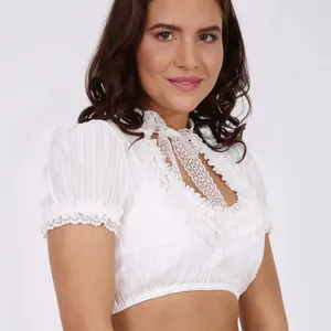 Elegant white lace crop top with puff sleeves and embroidery details on white background