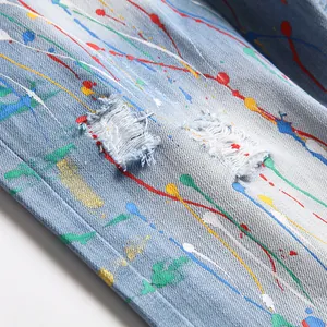 Hip hop distressed denim shorts with colorful paint splatter and shredded hole details