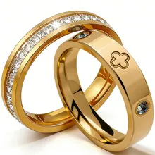Detail of gold couple rings showing blue gemstone engraving and pavé set zircon stones