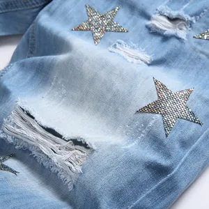 Men's light blue distressed denim shorts with sparkling rhinestone star embroidery