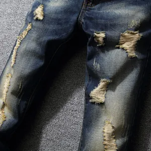 Vintage slim straight ripped jeans in classic blue denim with distressed streetwear details