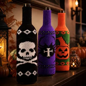 Detail of Halloween knitted wine bottle covers with skull, spider, and pumpkin patterns
